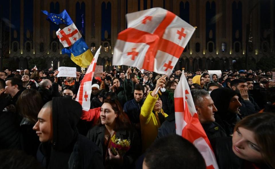 Protesters outside the Georgian parliament building in Tbilisi, Georgia, on March 8, 2023, objecting to the government's planned "foreign agent" law, reminiscent of Russian legislation. (Vano Shlamov/AFP via Getty Images)