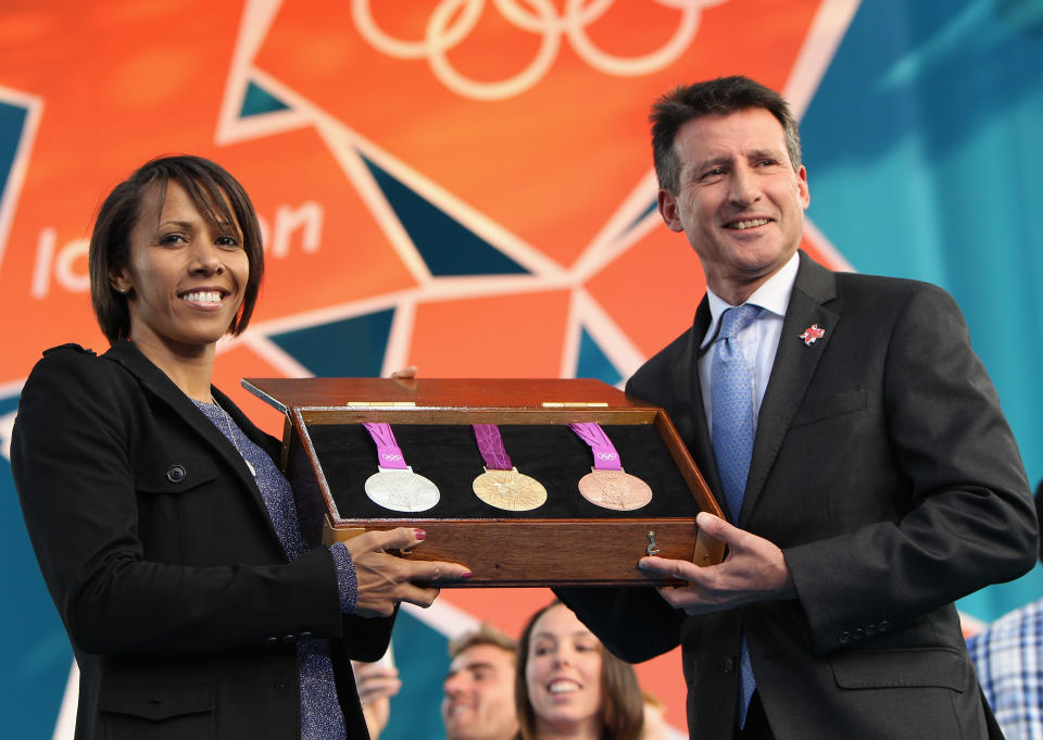 LONDON, ENGLAND - JULY 27: Dame Kelly Holmes and LOCOG Chairman Sebastian Coe present the olympic medals during the' London 2012 - One Year To Go' ceremony in Trafalgar Square on July 27, 2011 in London, England. The one year countdown to the London 2012 Olympic games was marked with a unique ceremony in Trafalgar Square, with IOC President Jacques Rogge inviting the world's athletes to compete in next summer's games. (Photo by Dan Kitwood/Getty Images)