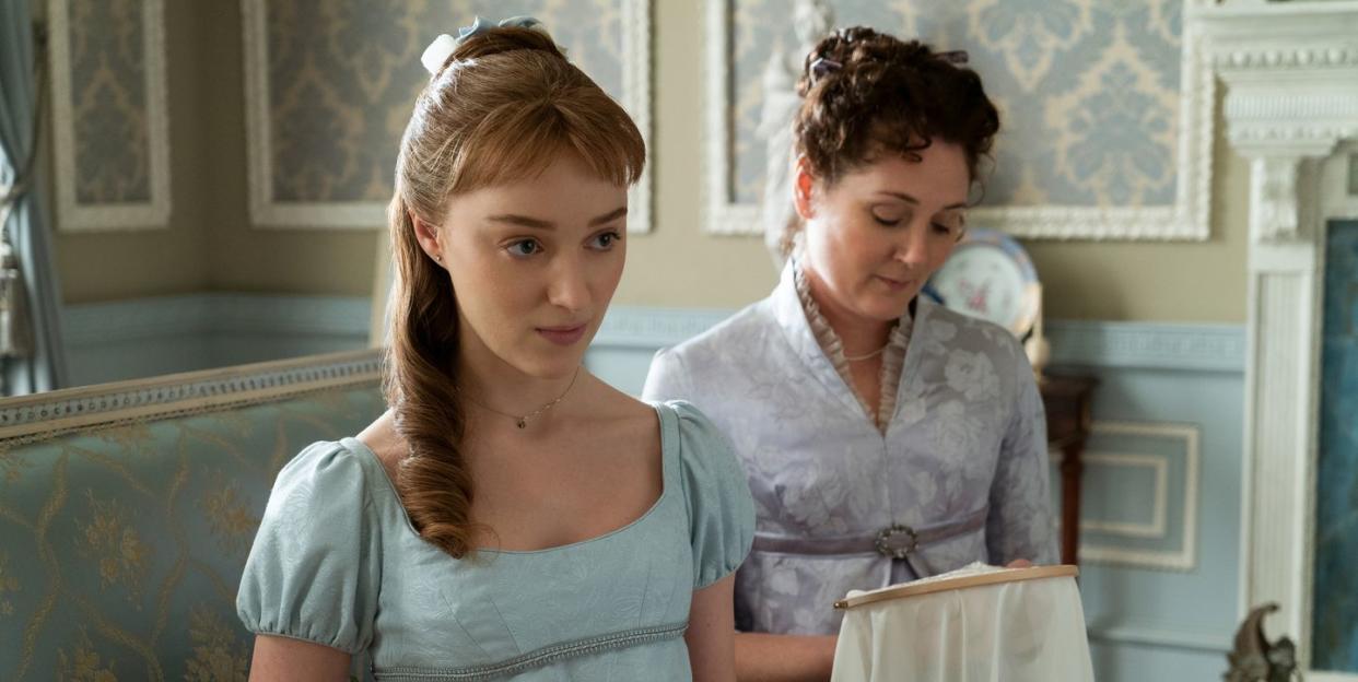 phoebe dynevor as daphne bridgerton sewing alongside ruth gemmell playing her mother in bridgerton, season 1