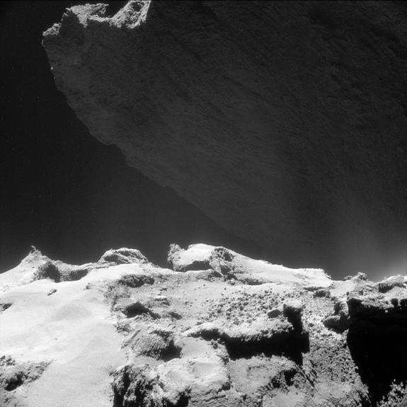 NavCam image of Comet 67P/C-G taken on Oct. 23, 2014 and released on May 5. The image shows a feature of the comet known as the cliffs of Hathor, which are roughly 2,952 feet (900 meters) high.