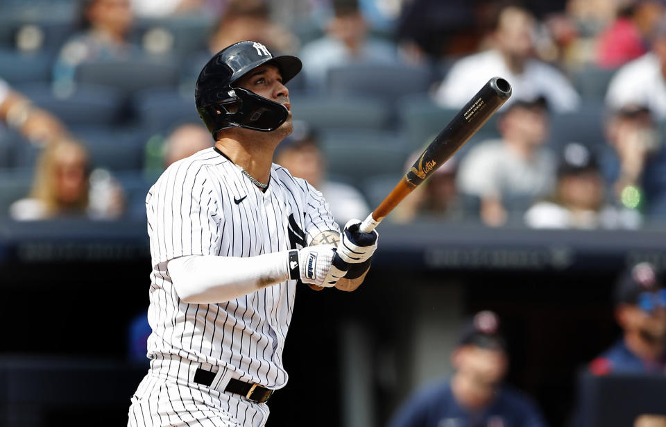 New York Yankees shortstop Marwin Gonzalez (14) follows through on a home run against the Minnesota Twins during the third inning of a baseball game Monday, Sept. 5, 2022, in New York. (AP Photo/Noah K. Murray)