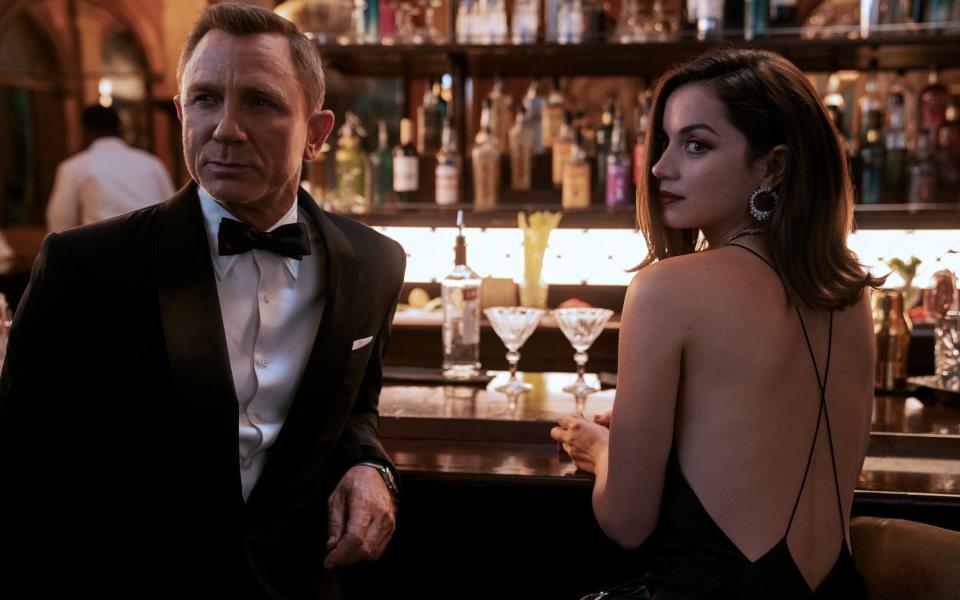 Daniel Craig playing James Bond and Ana de Armas playing Paloma in the new Bond film No Time To Die - Nicola Dove/PA Wire 