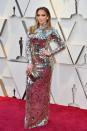 <p>A real-life disco glitterball in a high-kneck long-sleeve silver gown by Tom Ford.</p>