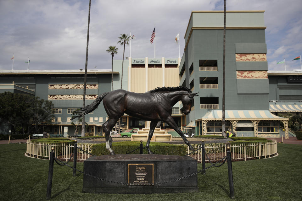 FILE - In this March 5, 2019, file photo, a statue of Zenyatta stands in the paddock gardens area at Santa Anita Park in Arcadia, Calif. A second horse in two days and 29th overall died at Santa Anita, Sunday, June 9, 2019, where management has chosen to continue racing for the rest of the current meet. (AP Photo/Jae C. Hong, File)