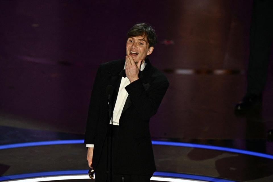 Cillian Murphy smiling onstage.