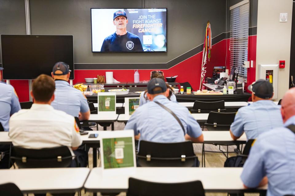 First responders listen to a video from David Perez, a North Collier firefighter diagnosed with cancer in 2019, during a cancer prevention class hosted by the University of Miami’s Sylvester Comprehensive Cancer Center at North Collier Fire and Rescue Station 45 in Naples on Wednesday, June 14, 2023.