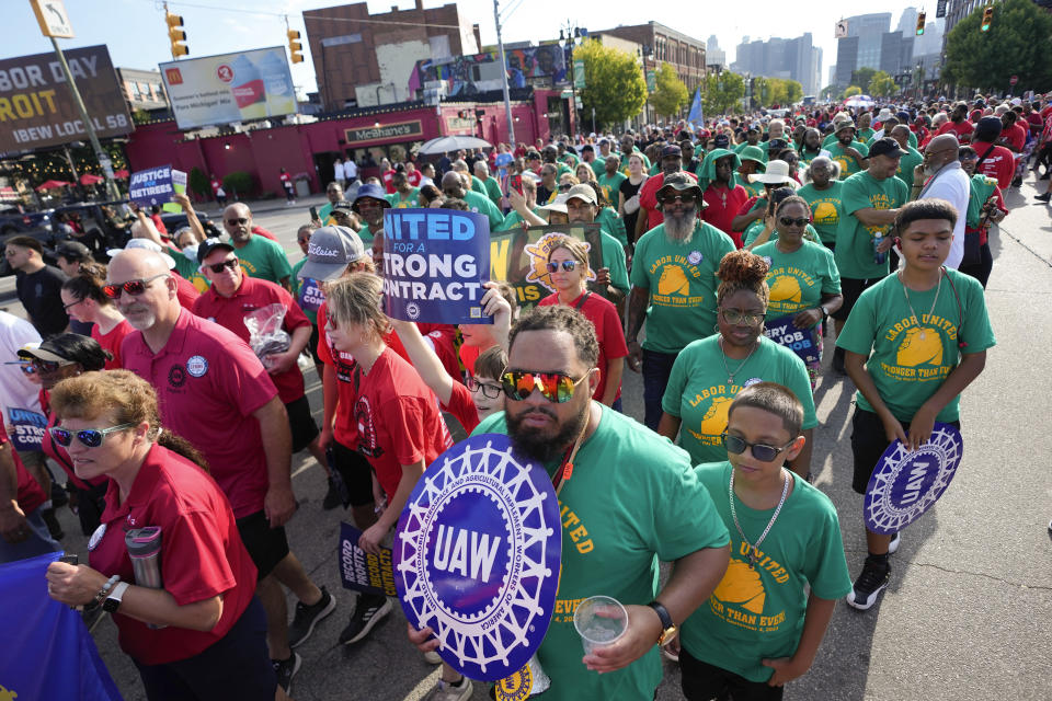 United Auto Workers members walk in the Labor Day parade in Detroit, Monday, Sept. 4, 2023. (AP Photo/Paul Sancya)