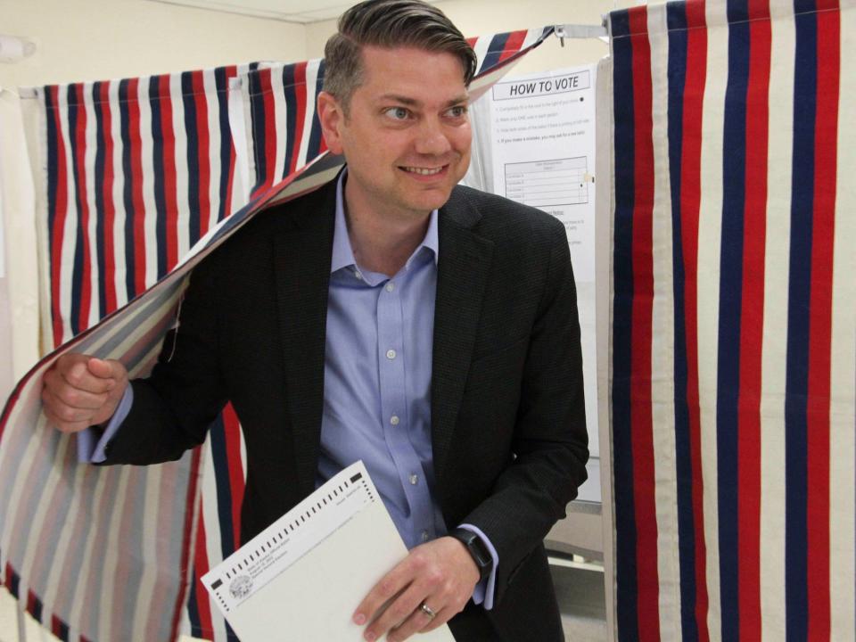 Republican candidate Nick Begich emerges from a voting booth in Anchorage, Alaska on August 10, 2022.