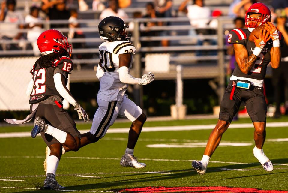 Bradford Chalil Cummings (2) hauls in a pass for an interception meant for Buchholz Bobcats Judah Nattiel (20).  The Bradford Tornadoes hosted the Buchholz Bobcats at Bradford High School in Starke, FL on Thursday, May 25, 2023. [Doug Engle/Gainesville Sun]