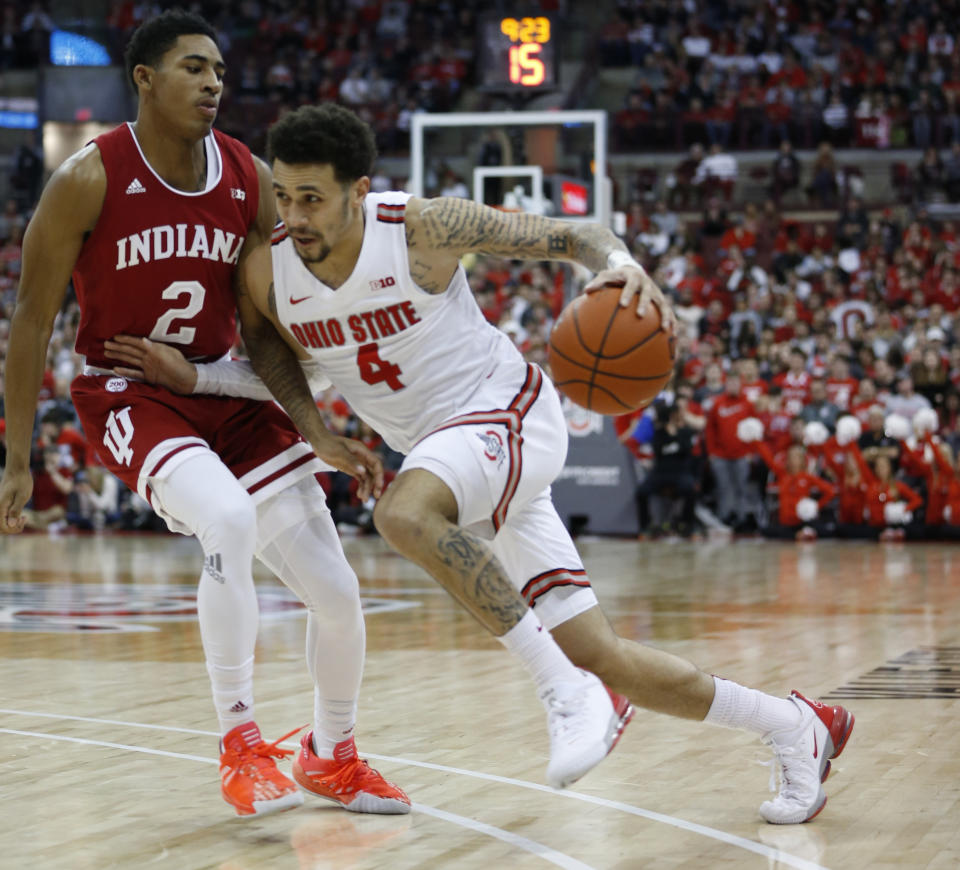 Ohio State's Duane Washington, right, drives to the basket against Indiana's Armaan Franklin during the second half of an NCAA college basketball game Saturday, Feb. 1, 2020, in Columbus, Ohio. Ohio State beat Indiana 68-59. (AP Photo/Jay LaPrete)