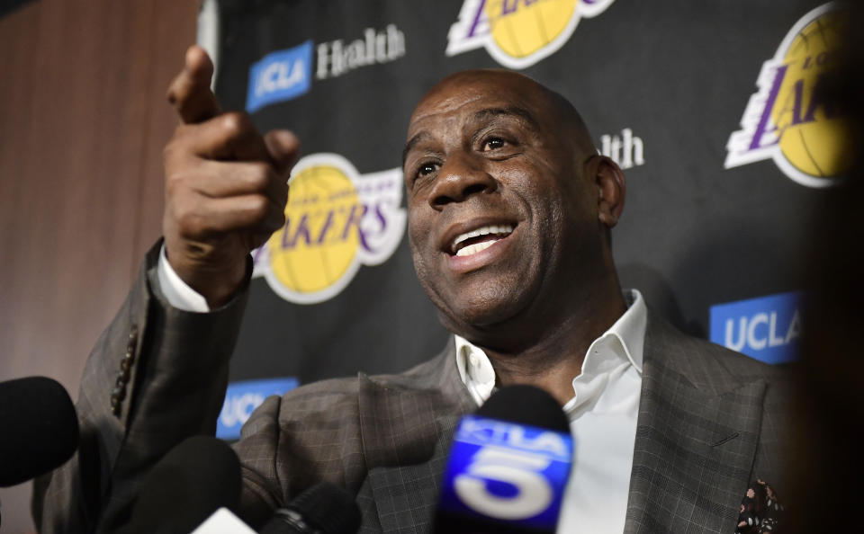 Magic Johnson speaks to reporters prior to an NBA basketball game between the Los Angeles Lakers and the Portland Trail Blazers on Tuesday, April 9, 2019, in Los Angeles. Johnson abruptly quit as the Lakers' president of basketball operations Tuesday night, citing his desire to return to the simpler life he enjoyed as a wealthy businessman and beloved former player before taking charge of the franchise just over two years ago. (AP Photo/Mark J. Terrill)