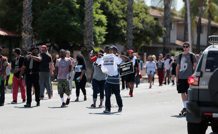 Protesters march at Mollison in El Cajon to protest the fatal shooting of an unarmed black man Tuesday by police in El Cajon, California, U.S. September 28, 2016. REUTERS/Earnie Grafton
