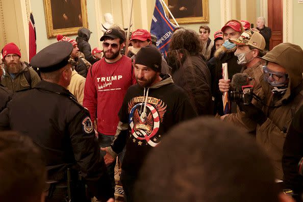 WASHINGTON, DC - JANUARY 06: Protesters interact with Capitol Police inside the U.S. Capitol Building on January 06, 2021 in Washington, DC. Congress held a joint session today to ratify President-elect Joe Biden's 306-232 Electoral College win over President Donald Trump. A group of Republican senators said they would reject the Electoral College votes of several states unless Congress appointed a commission to audit the election results. (Photo by Win McNamee/Getty Images)