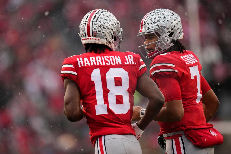 Ohio State Buckeyes quarterback C.J. Stroud (7) celebrates a touchdown by wide receiver Marvin Harrison Jr. (18) during the first half of the NCAA football game against the Indiana Hoosiers at Ohio Stadium in Columbus, Ohio, on Nov. 12, 2022.