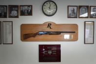 A shotgun made by Remington Arms, gifted by the company to the town, hangs on the wall of the municipal building in Ilion, N.Y., Thursday, Feb. 1, 2024. The nation’s oldest gun-maker is consolidating operations in Georgia and recently announced plans to shutter the Ilion factory in early March. (AP Photo/Seth Wenig)