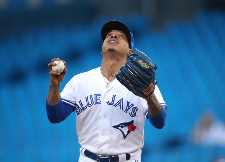 TORONTO, ON - JUNE 07: Marcus Stroman #6 of the Toronto Blue Jays says a prayer on the mound before pitching in the first inning during MLB game action against the Arizona Diamondbacks at Rogers Centre on June 7, 2019 in Toronto, Canada. (Photo by Tom Szczerbowski/Getty Images)