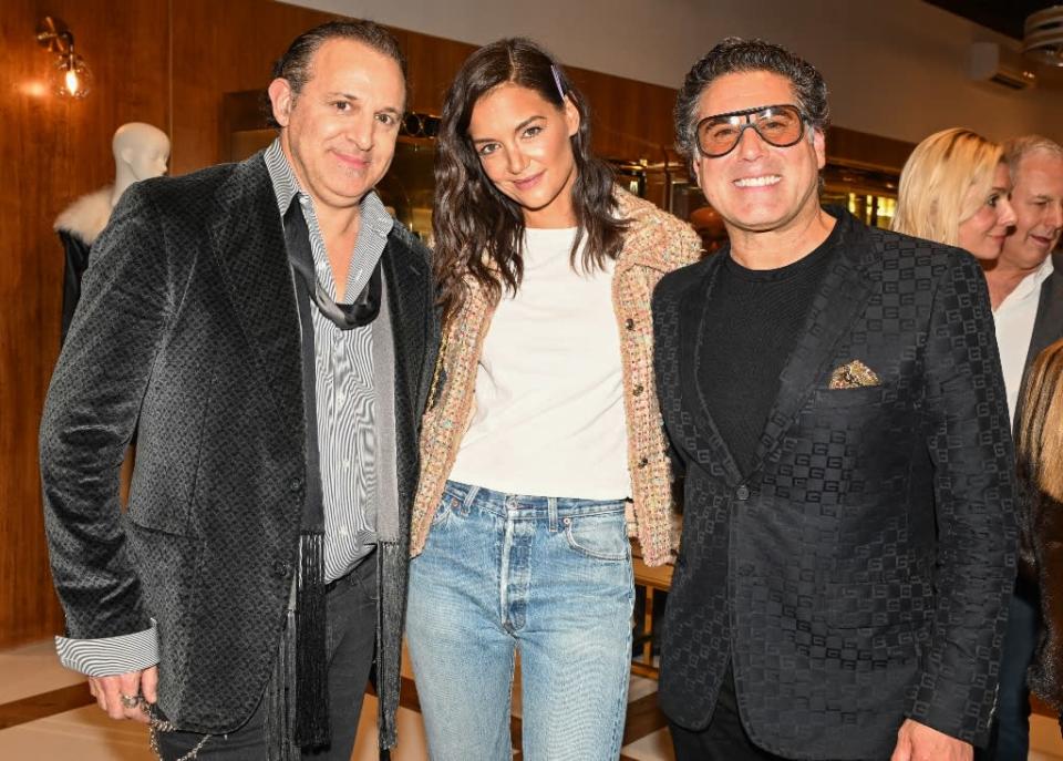 Seth Weisser, Katie Holmes and Gerard Maione at the What Goes Around Comes Around party in NYC on April 7. - Credit: Rupert Ramsay/BFA.com