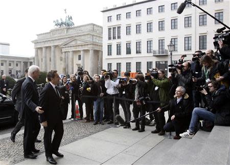 Former French President Nicolas Sarkozy arrives at the Pariser Platz square to attend an event hosted by the Konrad-Adenauer foundation in Berlin February 28, 2014. REUTERS/Tobias Schwarz