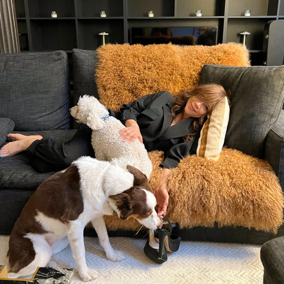 Rosie Perez lounges with some furry friends, Karma and Teddy Bear.