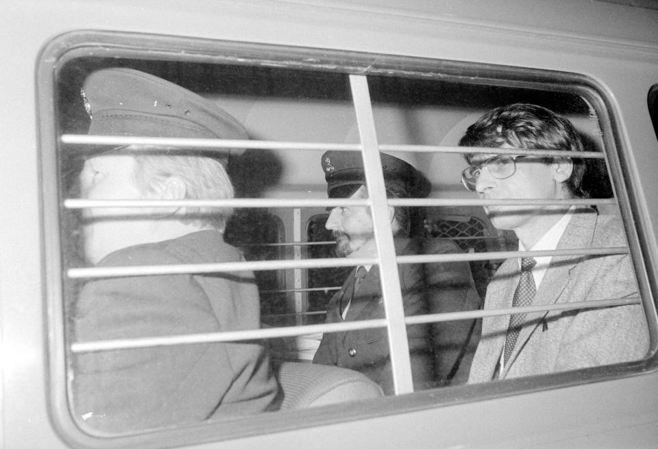 BLACK AND WHITE ONLY File photo dated 04/11/83 of mass murderer Dennis Nilsen (right), with a prison warden at his side, after he was sentenced to a minimum of 25 years imprisonment after being convicted of six murders and two attempted murders at the Old Bailey. Infamous serial killer Nilsen spent his final day in prison lying in his cell suffering from internal bleeding, an inquest has heard.