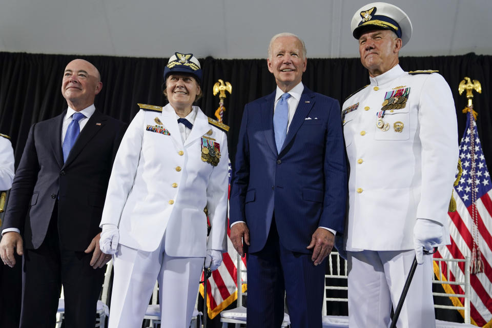 President Joe Biden poses for a photo with Homeland Security Secretary Alejandro Mayorkas, left, Adm. Linda Fagan, Commandant of the U.S. Coast Guard, second from right, and Adm. Karl Schultz, right, during a change of command ceremony at U.S. Coast Guard headquarters, Wednesday, June 1, 2022, in Washington. Schultz, was relieved by Fagan as the Commandant of the U.S. Coast Guard. (AP Photo/Evan Vucci)