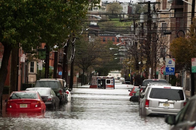 An ambulance sits abandoned in the middle of a flooded street after Hurricane Sandy October 30, 2012 in Hoboken, New Jersey. 