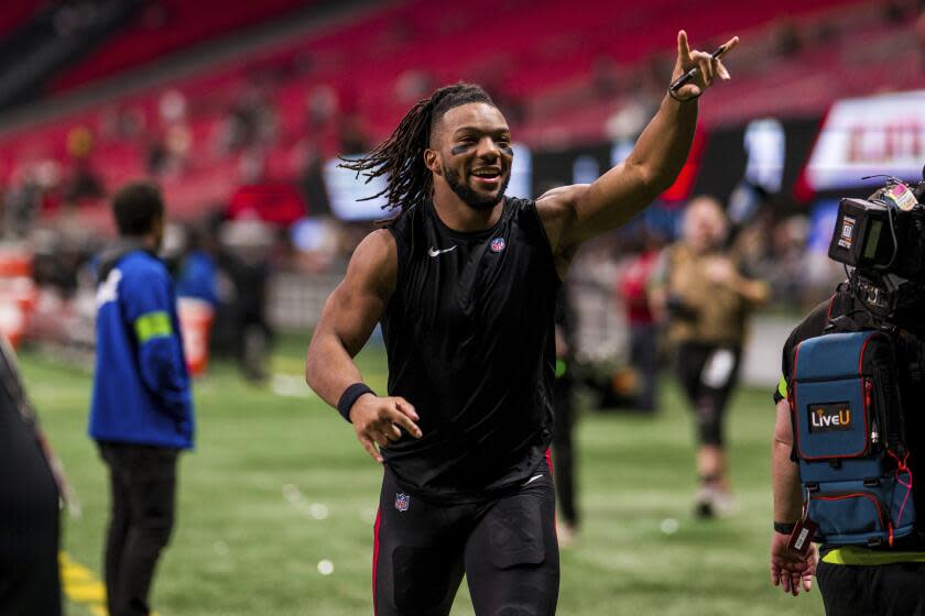 Atlanta Falcons running back Bijan Robinson (7) runs off the field after an NFL football game