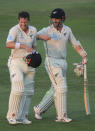 New Zealand's batsmen, Henry Nicholls, left, and Kane Williamson talk as they leave the pitch at the end of forth day in their test match against Pakistan in Abu Dhabi, United Arab Emirates, Thursday, Dec. 6, 2018. (AP Photo/Kamran Jebreili)