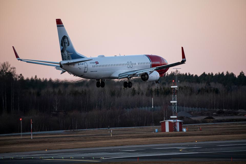 A Norwegian plane approaches Arlanda airport, north of Stockholm, on March 16, 2020, where air traffic slowed down due to the spread of the novel coronavirus COVID-19. (Photo by Jonathan NACKSTRAND / AFP) (Photo by JONATHAN NACKSTRAND/AFP via Getty Images)