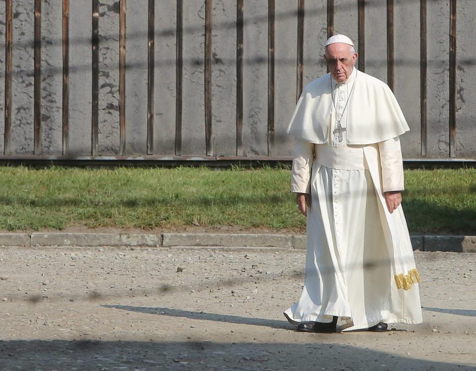 Pope Francis walks through the gate of the former Nazi German death camp of Auschwitz in Oswiecim, Poland, Friday, July 29, 2016. (AP Photo/Czarek Sokolowski)