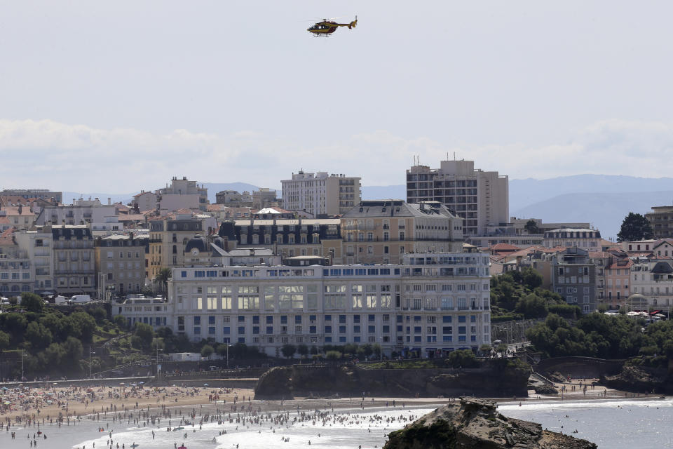 A security helicopter flies over the G7 summit venue Casino Bellevue, Wednesday, Aug. 21, 2019 in Biarritz, southwestern France. Leaders of the Group of Seven nations will meet Saturday for three days in the southwestern French resort town of Biarritz. France holds the 2019 presidency of the G-7, which besides the U.S. also includes Britain, Canada, Germany, Italy and Japan. (AP Photo/Bob Edme)