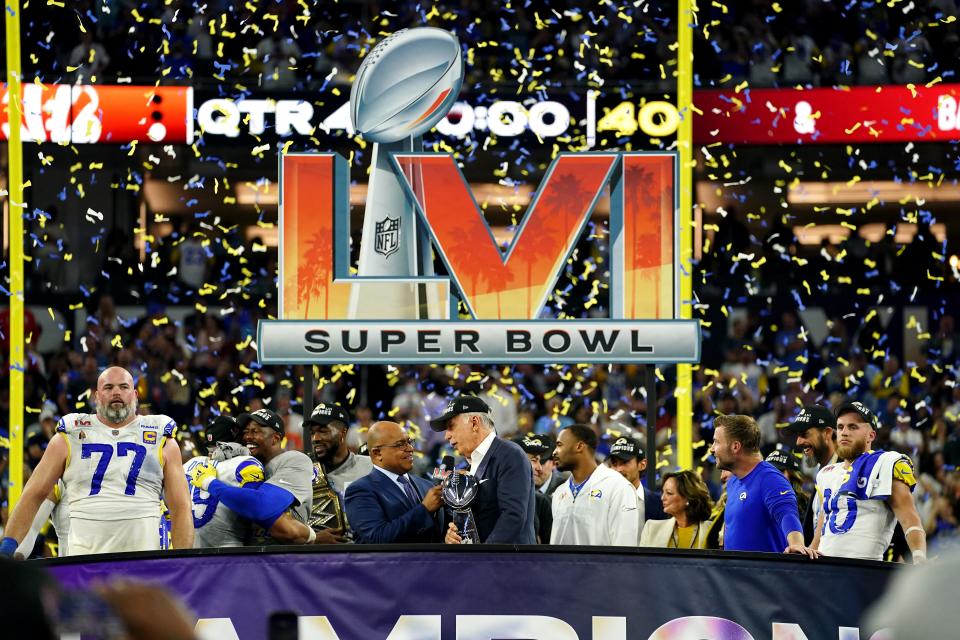 Los Angeles Rams owner Stan Kroenke receives the Lombardi Trophy at the conclusion of Super Bowl 56 after the Rams defeated the Cincinnati Bengals 23-20 at SoFi Stadium in Inglewood, Calif.