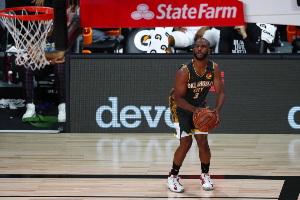 Chris Paul #3 of the Oklahoma City Thunder shoots the ball against the Denver Nuggets during the fourth quarter in a NBA basketball game at The Arena at ESPN Wide World Of Sports Complex.