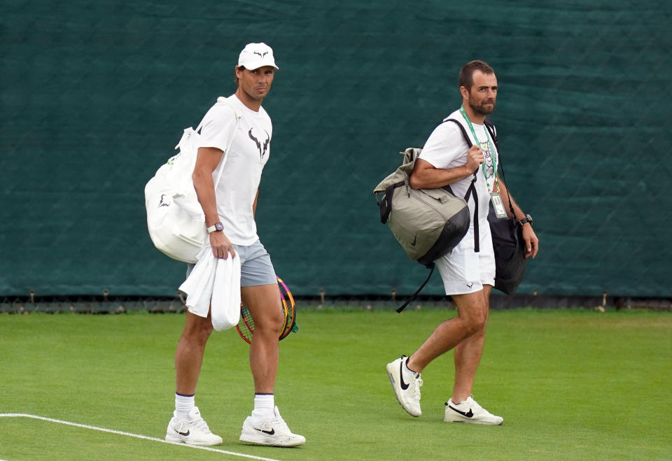 Rafael Nadal (pictured) heading to a practice session at Wimbledon.