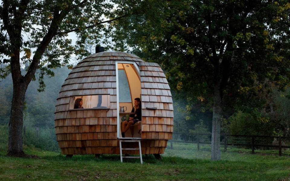 The escape pod, an ellipsoid room clad in cedar shingles and made using birch ply and oak by Podmakers, from £19,800