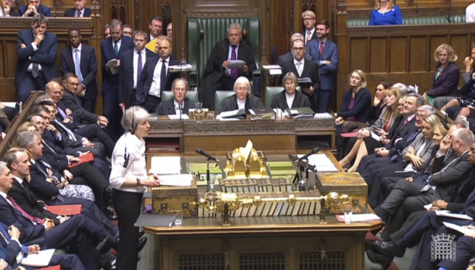 Britain's Prime Minister Theresa May addresses the House of Commons, London, with an update on the latest developments in the Brexit negotiations, Monday Oct. 15, 2018. (PA via AP)