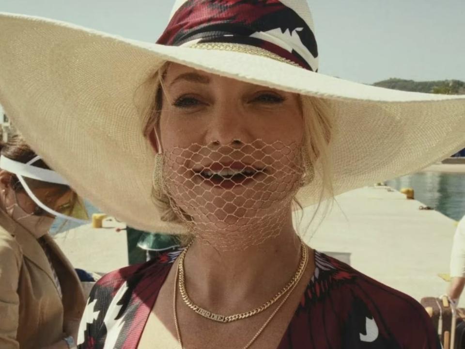 Kate Hudson as Birdie Jay wearing a mesh face mask.