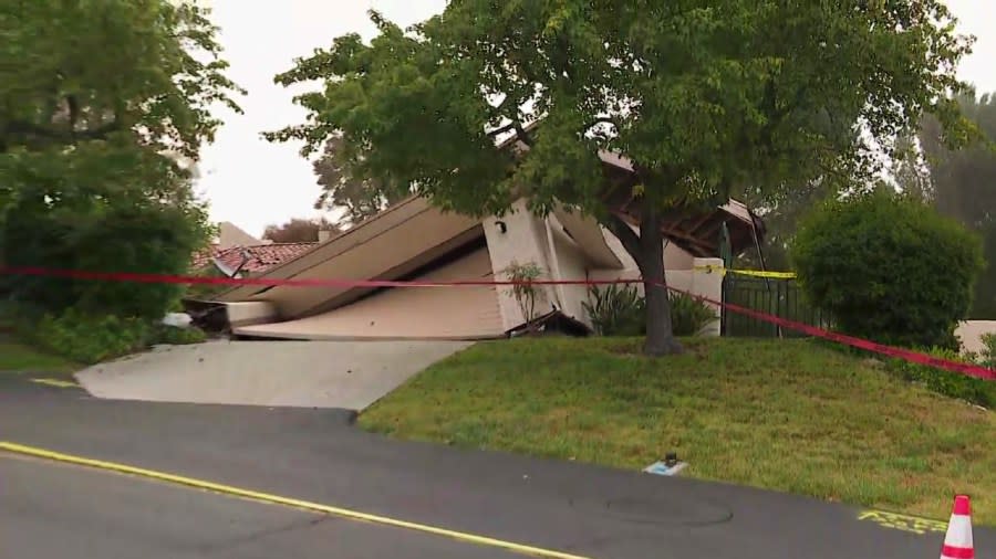 A collapsing home is seen in Rolling Hills estates