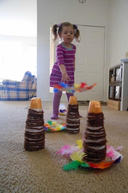 <p>Hands On As We Grow</p><p>This can be played inside or outside! Find out to make your own Thanksgiving-inspired ring toss game by visiting <a href="https://handsonaswegrow.com/thanksgiving-turkey-ring-toss/" rel="nofollow noopener" target="_blank" data-ylk="slk:Hands On As We Grow;elm:context_link;itc:0;sec:content-canvas" class="link "><em>Hands On As We Grow</em></a>.</p>