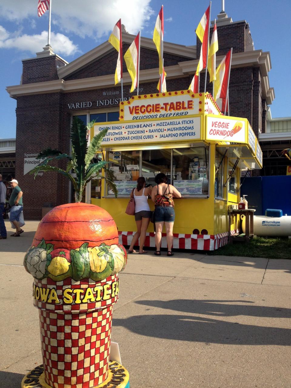 The Veggie Table, a food stand at the Iowa State Fair since 1982, offers vegetarian and vegan option. The family owned business is run by Bryan McCoy, his wife Miranda McCoy and his cousins Melissa Dale and Valerie Heath.