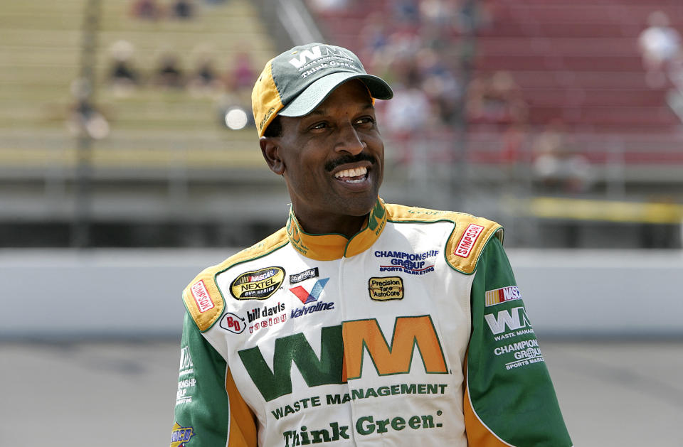 Bill Lester smiles prior to qualifying for the NASCAR Nextel Cup 3M Performance 400 at Michigan International Speedway in Brooklyn, Mich., Friday, June 16, 2006. Lester, the first black driver to race in NASCAR's top stock car series in 20 years, backed up his solid qualifying run in March at Atlanta with another strong performance qualifying 34th. (AP Photo/Paul Sancya)