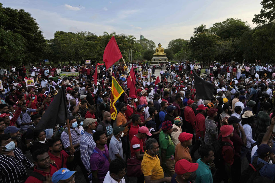 Supporters of Sri Lanka's opposition political party National People's Power participate an anti-government protest rally in Colombo, Sri Lanka, Tuesday, April 19, 2022. Sri Lanka’s prime minister said Tuesday the constitution will be changed to clip presidential powers and empower Parliament as protesters continued to call on the president and his powerful family to quit over the country's economic crisis. (AP Photo/Eranga Jayawardena)