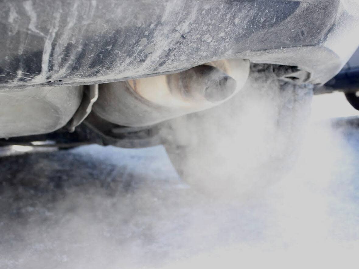 Exhaust emissions from the tail pipe of a vehicle in Yellowknife. According to 2013 data, Yellowknife, as a community, emitted 305,000 tonnes of carbon dioxide equivalent that year.  (Liny Lamberink/CBC - image credit)