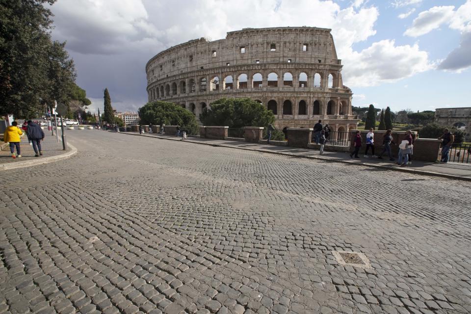 A view of the Colosseum, in Rome, Saturday, March 7, 2020. With the coronavirus emergency deepening in Europe, Italy, a focal point in the contagion, risks falling back into recession as foreign tourists are spooked from visiting its cultural treasures and the global market shrinks for prized artisanal products, from fashion to design. (AP Photo/Andrew Medichini)