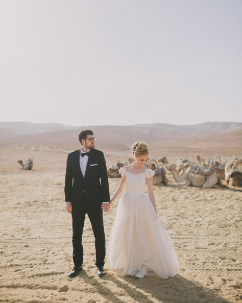 Save money on your drink tab by inviting only camels to your desert wedding! (Kidding … kind of.)