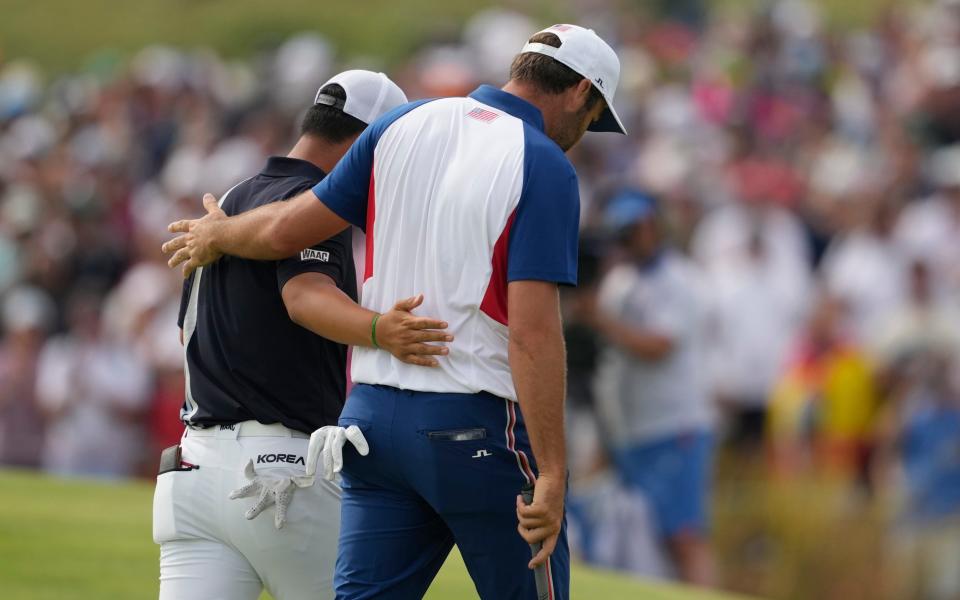 Scottie Scheffler, right and Kim walked together from the 18th green after completing their the final round of the men's golf at Le Golf National