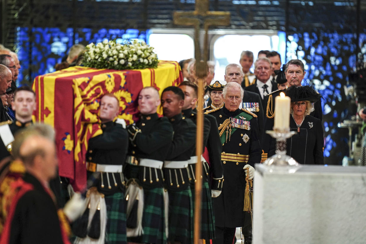 Image: King Charles III and Camilla, the Queen Consort, Princess Anne and Tim Laurence, and Prince Andrew follow the coffin as they enter the cathedral for a Service of Prayer and Reflection for the Life of Queen Elizabeth II at St Giles' Cathedral, Edinburgh on Sept. 12, 2022. (Jane Barlow / PA via AP)