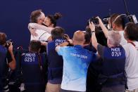 <p>Upon learning that she had won gold, Lee hugged her coach Jess Graba, who has been her coach since elementary school.</p> <p>"She's tough as nails," Graba told the <a href="https://www.washingtonpost.com/sports/olympics/2021/07/29/olympic-gymnastics-all-around-final/" rel="nofollow noopener" target="_blank" data-ylk="slk:Washington Post;elm:context_link;itc:0;sec:content-canvas" class="link "><em>Washington Post</em></a>. "People don't see that. They don't know how hurt she is. They don't know how stressed out she is. They don't know how nervous she is."</p>