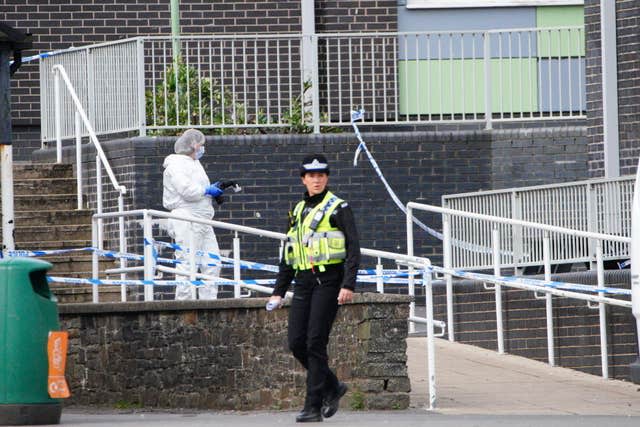 Police and forensic investigators at Amman Valley School, in Ammanford, Carmarthenshire. 