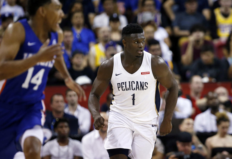 New Orleans Pelicans' Zion Williamson (1) runs upcourt during the team's NBA summer league basketball game against the New York Knicks Friday, July 5, 2019, in Las Vegas. Knicks' Allonzo Trier is at left. (AP Photo/Steve Marcus)